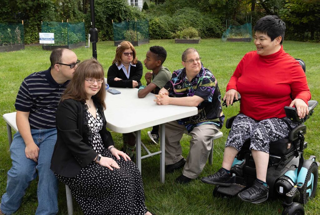 Rose House Residents outside relaxing