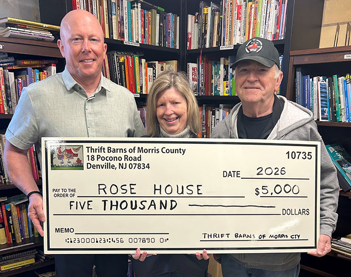 Jenny, a resident of our Independent Living program at Rose House’s Hanover Community Residence, is pictured with Rose House CEO Tom Mitchell (left) and Thrift Barns of Morris County President George Janowicz.